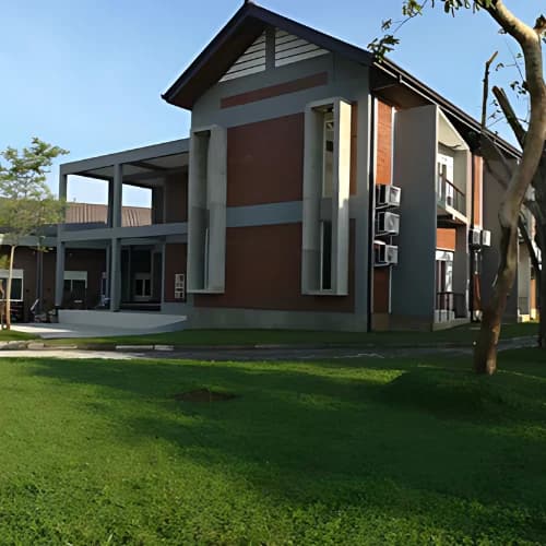 DKS archive: finished two-storey building beside a lawn