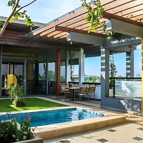 DKS archive: poolside terrace beneath a timber pergola